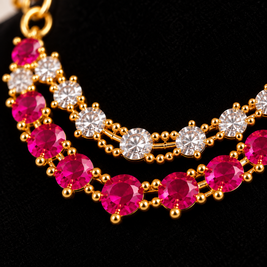 Close up of red and round white stones on Laddu Gopal deity necklace